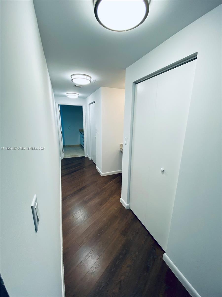 Hallway with two huge walk in closets