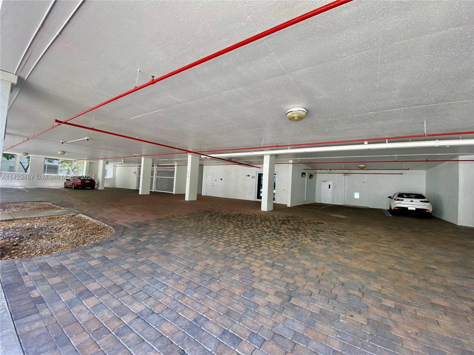 Entrance to garage and visitor parking