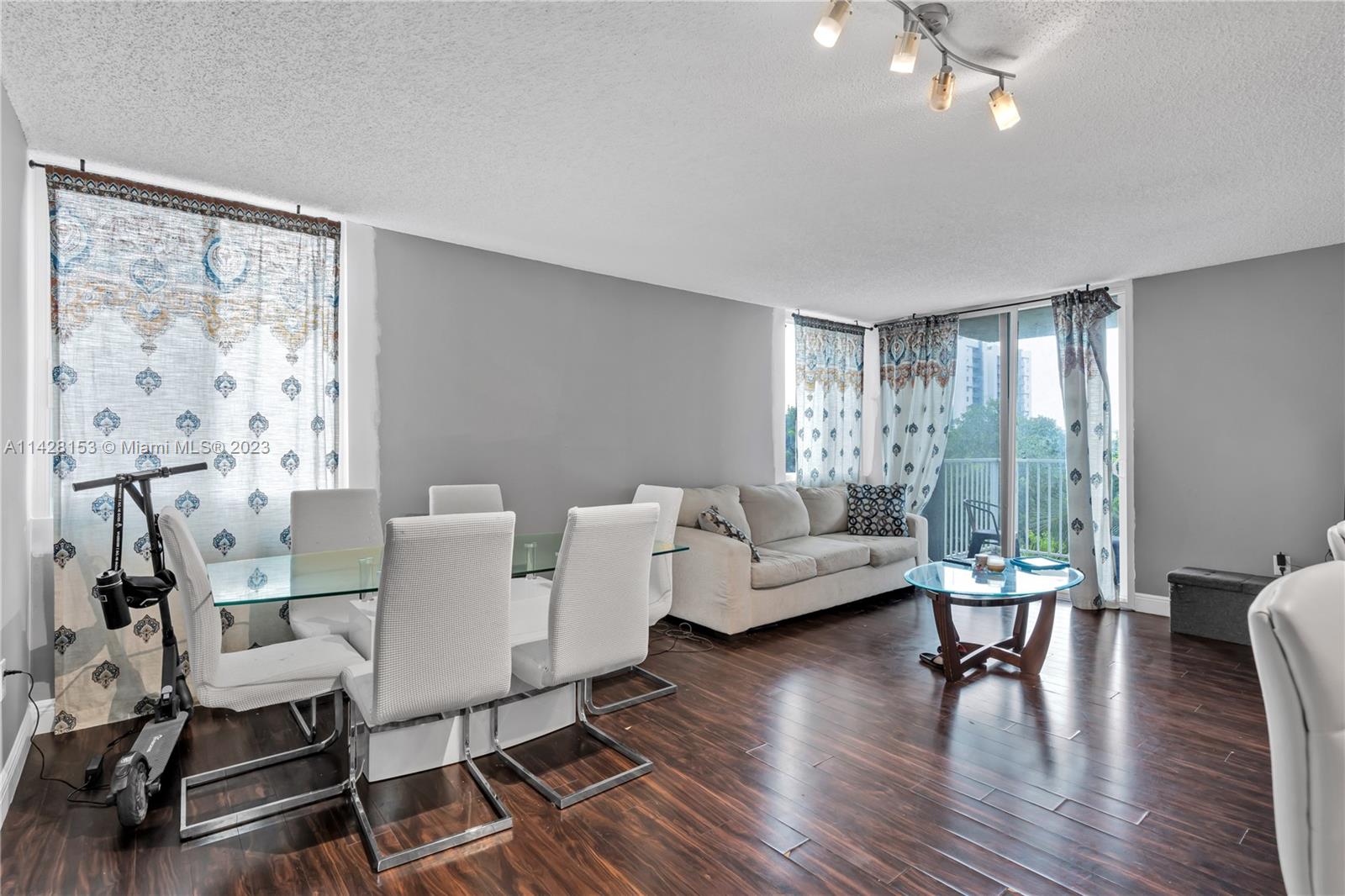 open living/dining area overlooking the balcony