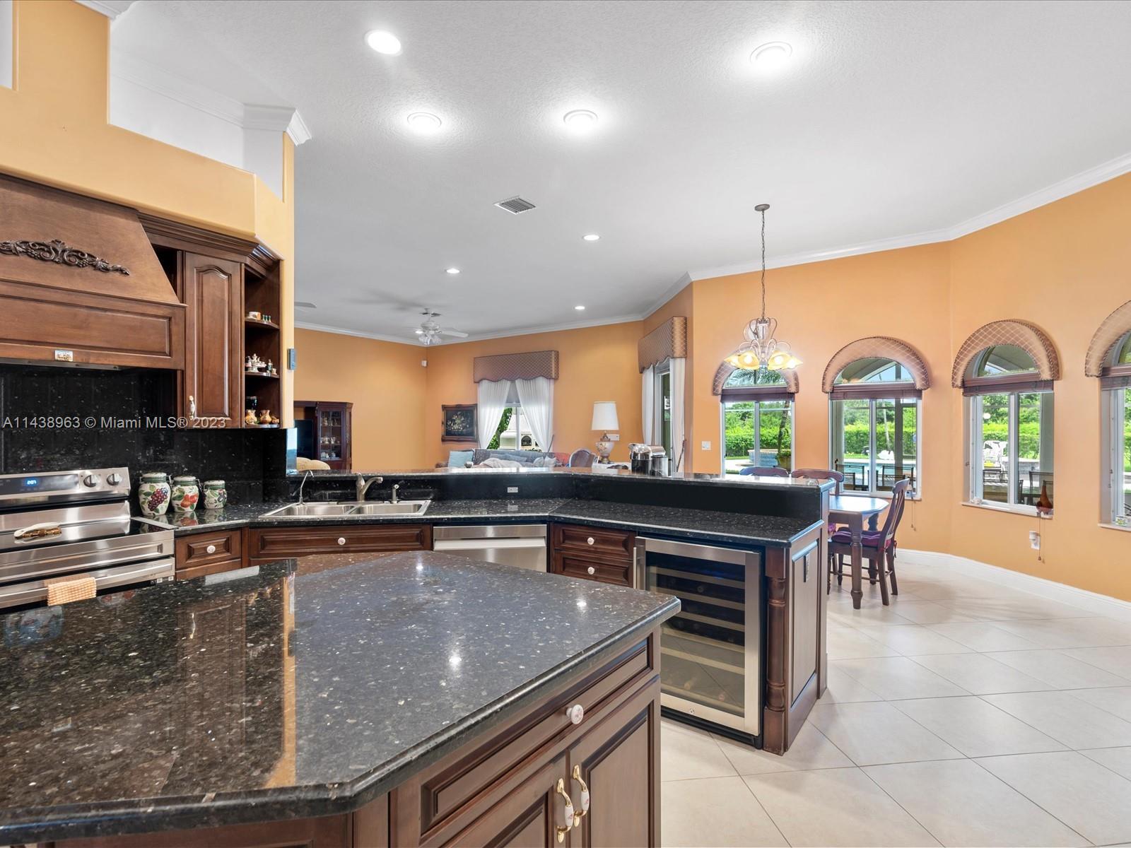 Extraordinary Chef Kitchen with Luxurious Wood Cabinets and Top of the Line Appliances