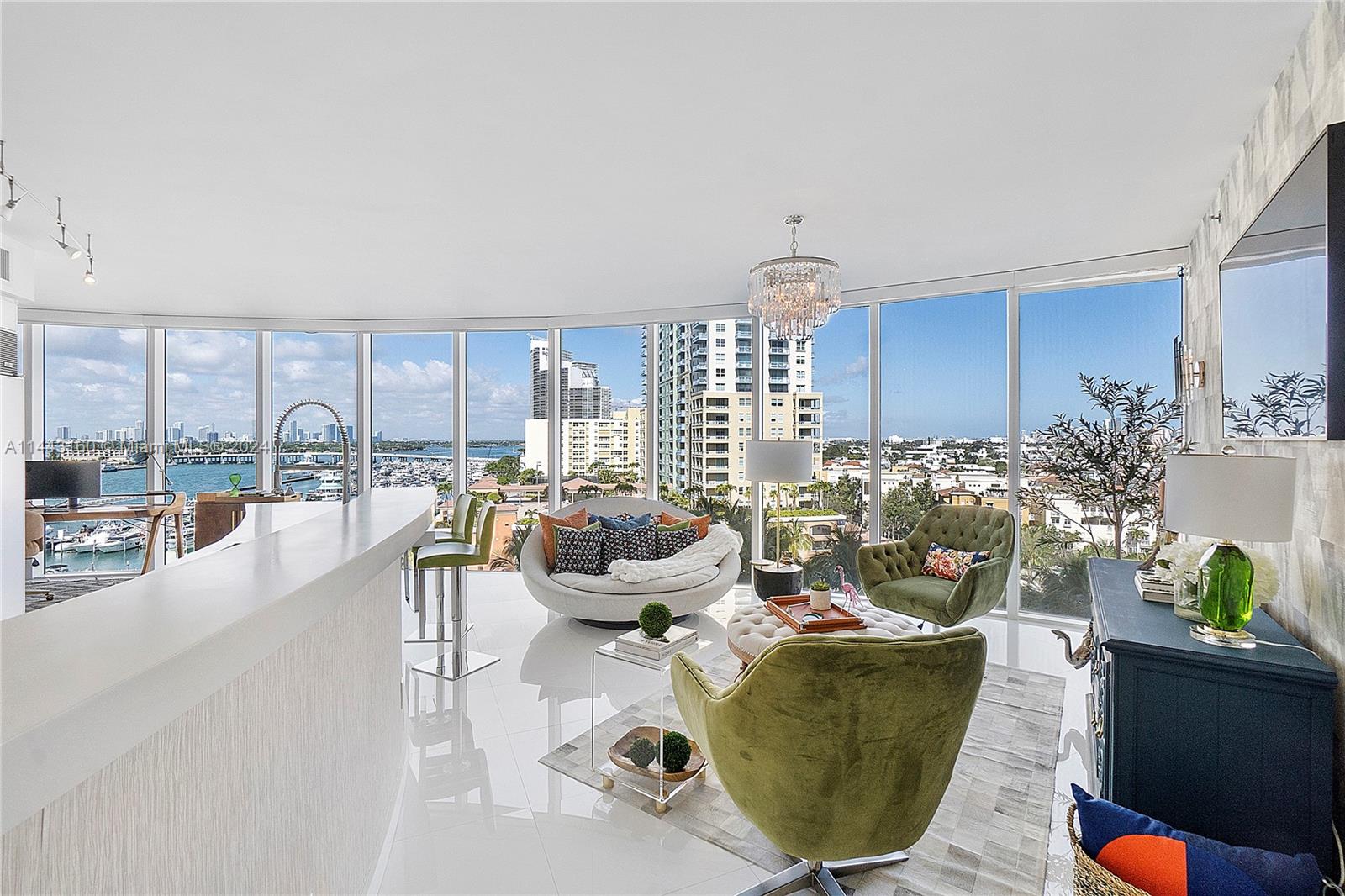 Experience one-of-a-kind indulgence in this rare corner unit showcasing dramatic views of Biscayne Bay, Fisher Island, South Beach, and the glittering Miami cityscape. The sleek interior radiates modern elegance with custom details like built-ins and a chef's kitchen appointed with premium appliances. Entertain effortlessly on the sprawling 14-foot-deep balcony, directly accessible from the light-filled living room. Retreat to the spa-like main bathroom off the iconic primary bedroom. The two spacious terraces overlook both city and sea. Enjoy exclusive amenities like a private beach club. Beyond your private oasis, some of the world's best dining, beaches and marinas are just minutes away. This is luxury, convenience, and beauty combined in a truly matchless way.