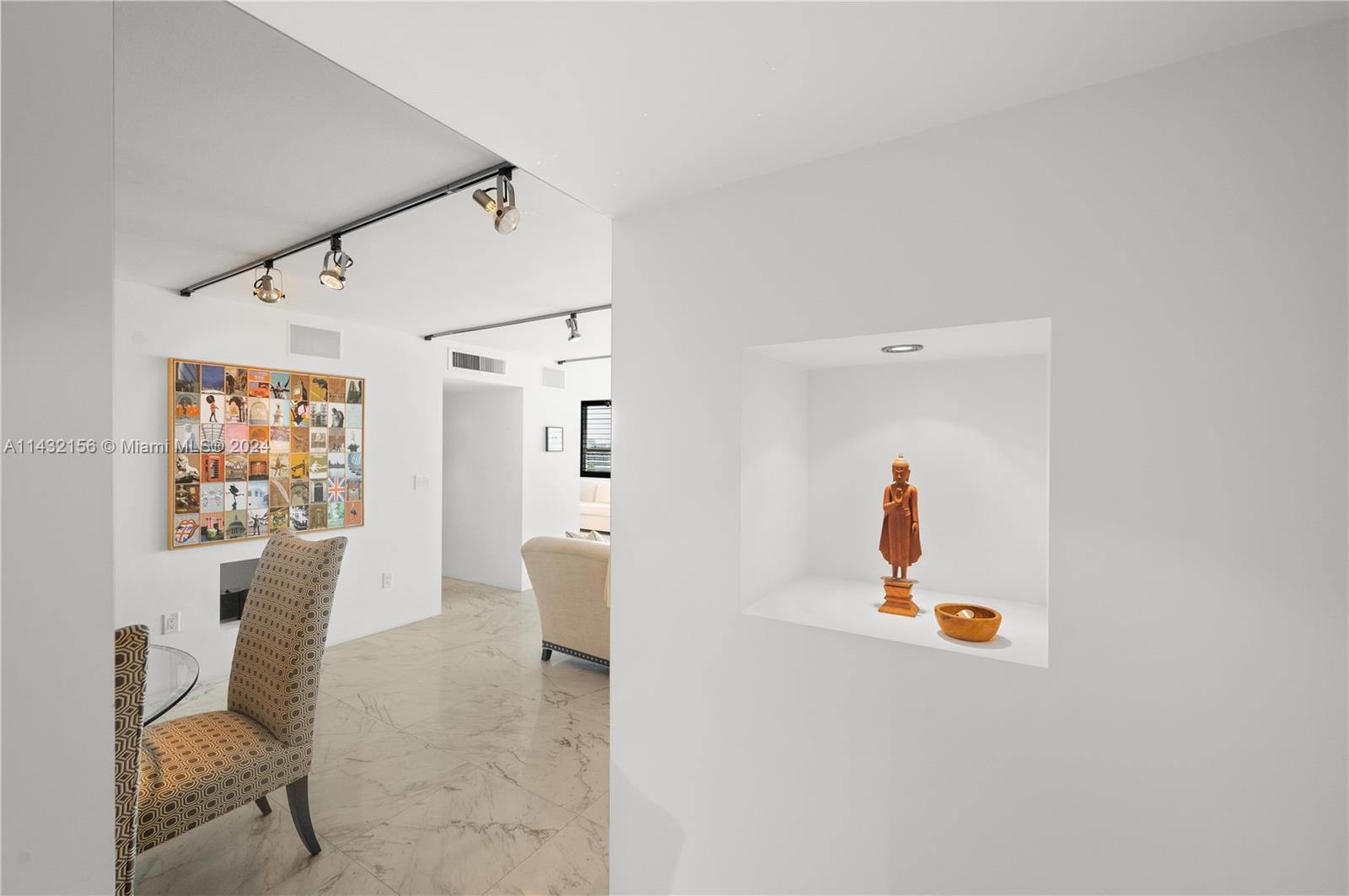 Foyer has niche for art/storage on the other side artwork/display
