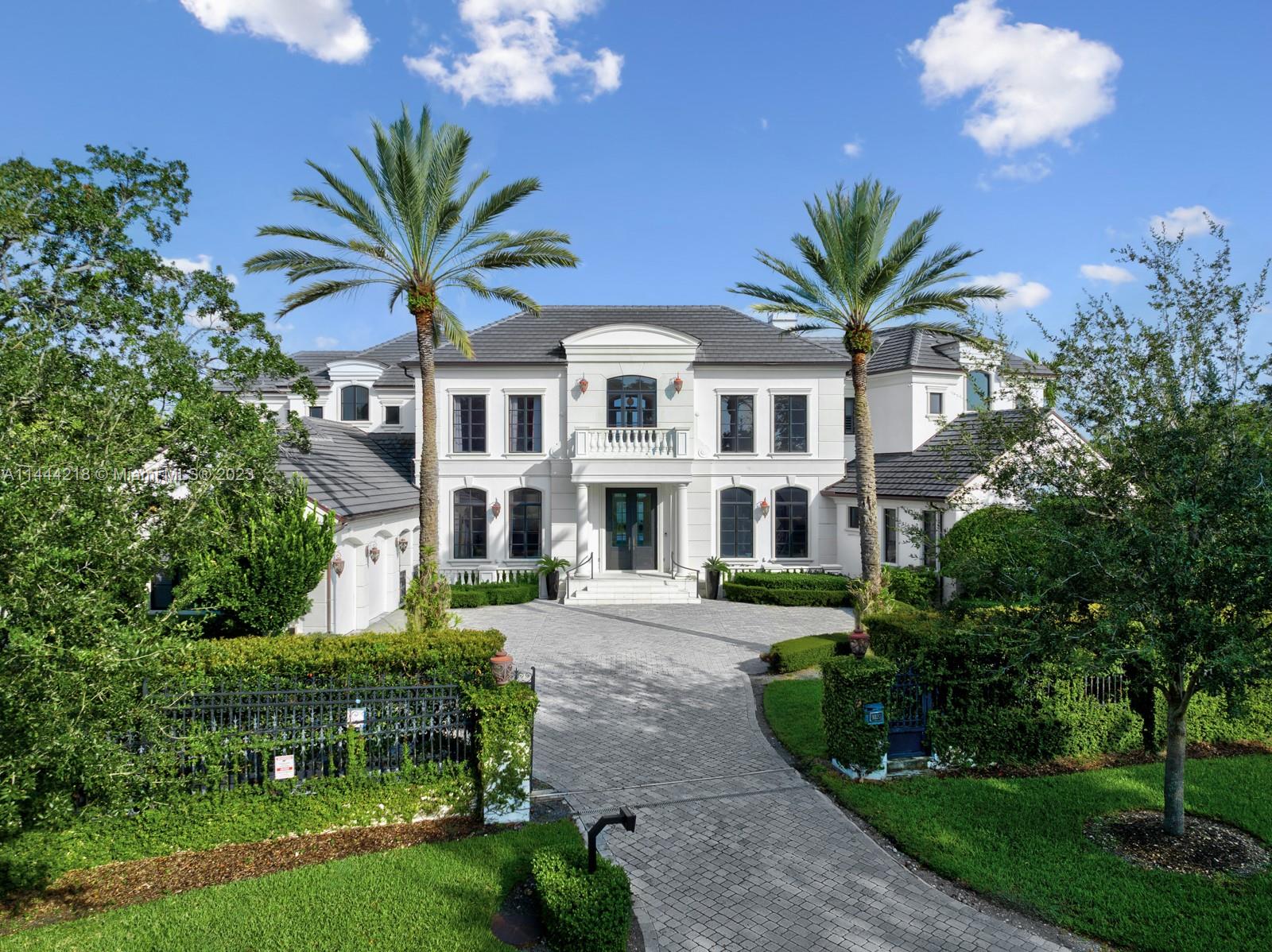 In the highly coveted & gated Coral Gables community of Old Cutler Bay, this stunning residence was designed by famed architect Ramon Pacheco & remodeled in 2015 offering modern luxury living. This architectural marvel showcases a grand foyer with a sweeping staircase & soaring ceilings that welcomes an abundance of natural light and elegance. The focal point of this magnificent estate, however, is the 100' private dock, providing direct ocean access. Features include custom finishes, full house generator, in-home theater, 2 guest suites, staff quarters, and a 4-car garage. Complete with an infinity-edge pool, plenty of covered terraces, and beautiful water views.