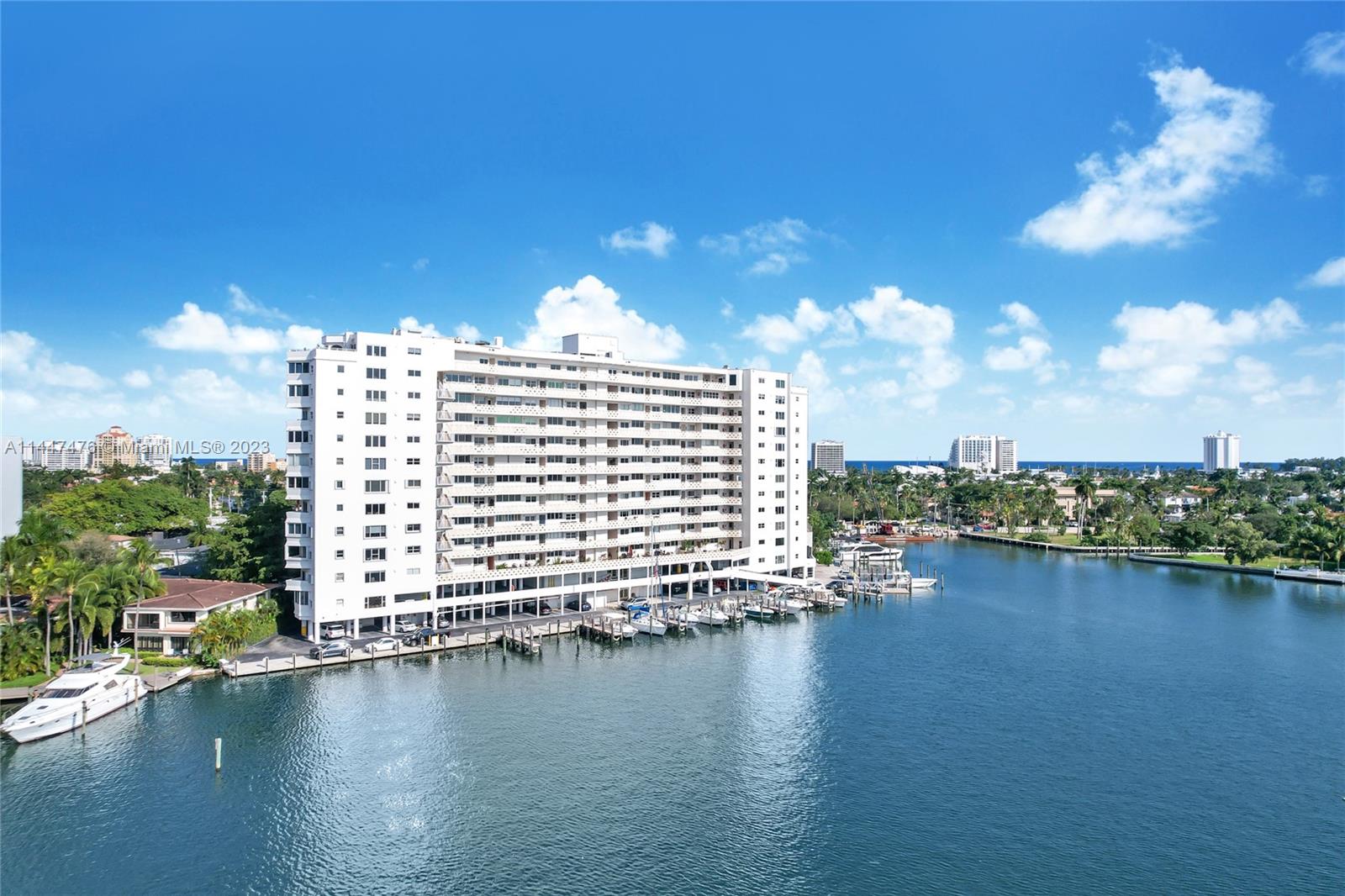 Highly desirable double unit at The Four Seasons, a boutique luxury residence located on Sunset Lake and less than one block to Las Olas and the Intracoastal. This elegant, 3 BR/3.5 BA plus den designer flow thru model was completely renovated with fine fixtures and finishes throughout, including Schonbek chandeliers and custom millwork. Features include impact windows and doors, 9’ ceilings, split bedrooms with en-suite baths, multiple walk-in closets, oversized terrace, marble/wood flooring, gourmet kitchen, wet bar, separate laundry room, 2 parking spaces and much more. Enjoy spectacular views from all rooms. Dockage available for up to a 40+' boat with no fixed bridges and easy ocean access.  Large dogs allowed and unit can be rented immediately for annual lease. Furniture negotiable.