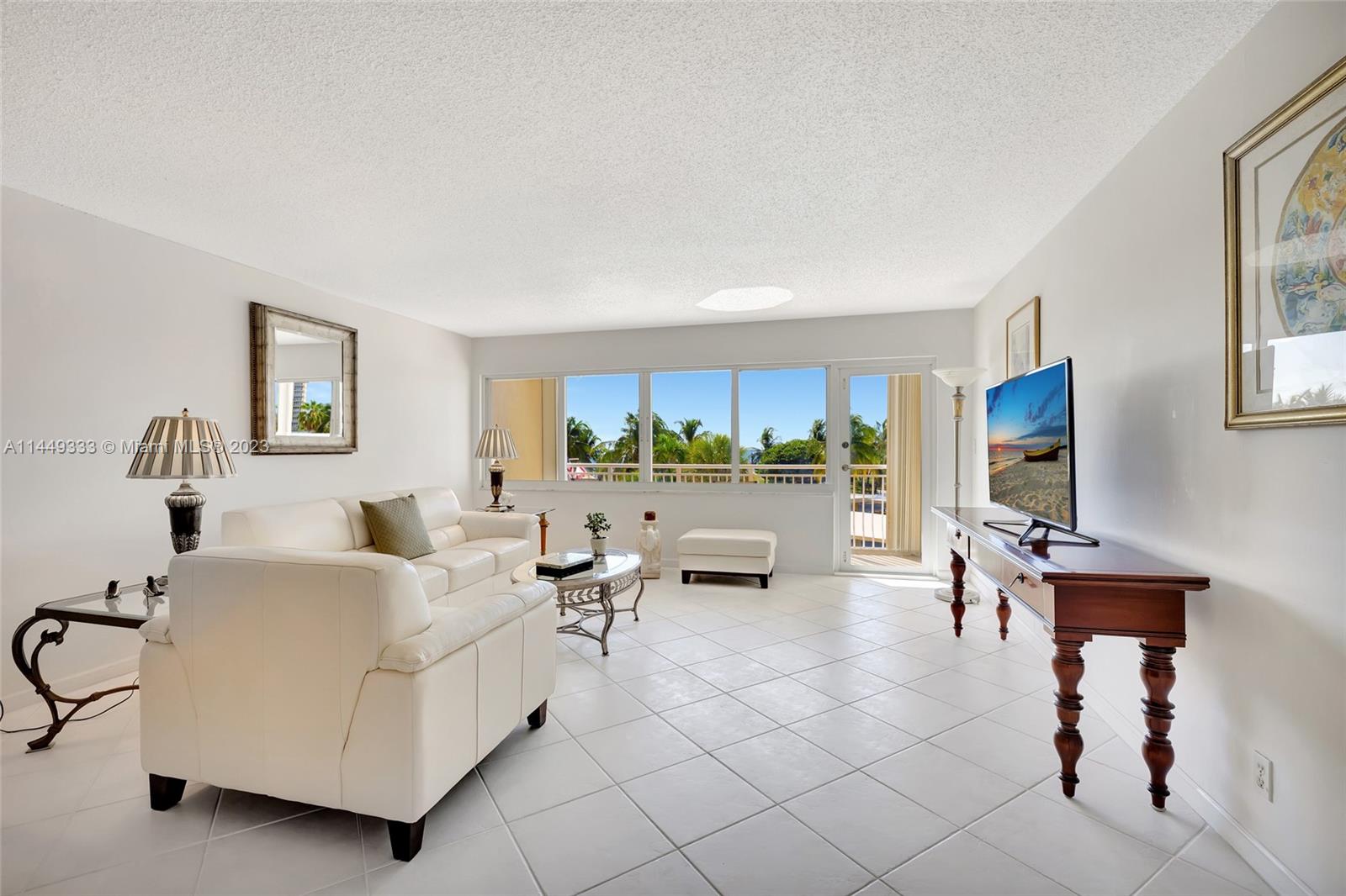 Living Room and balcony with pool and ocean view