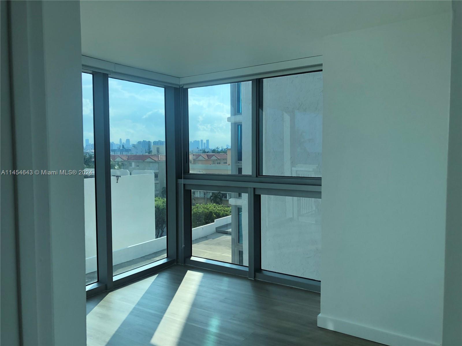 Clean lines leading from living-dingin area down hall to primary bedroom