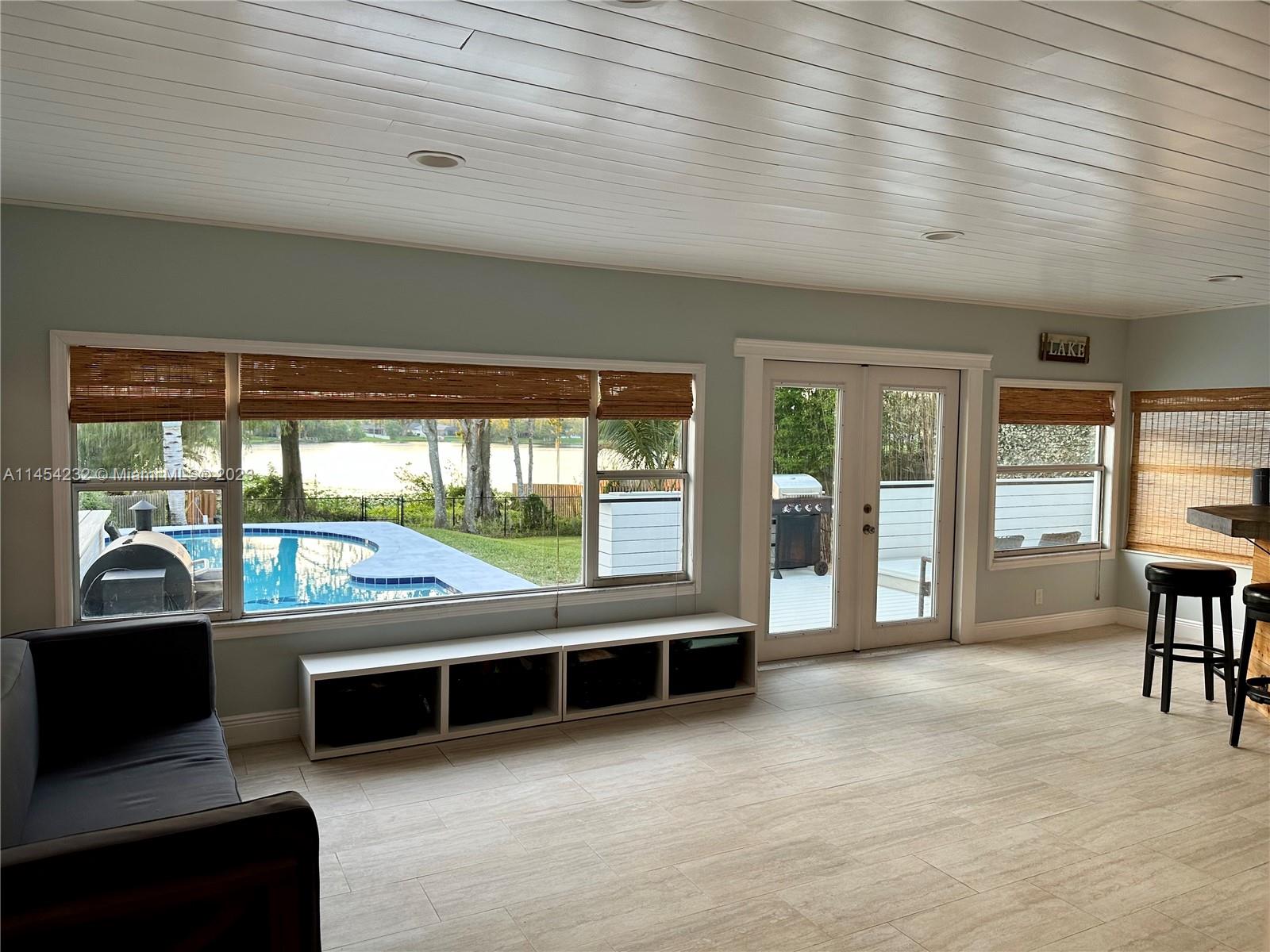 Family Room leading out to patio/pool with lake view