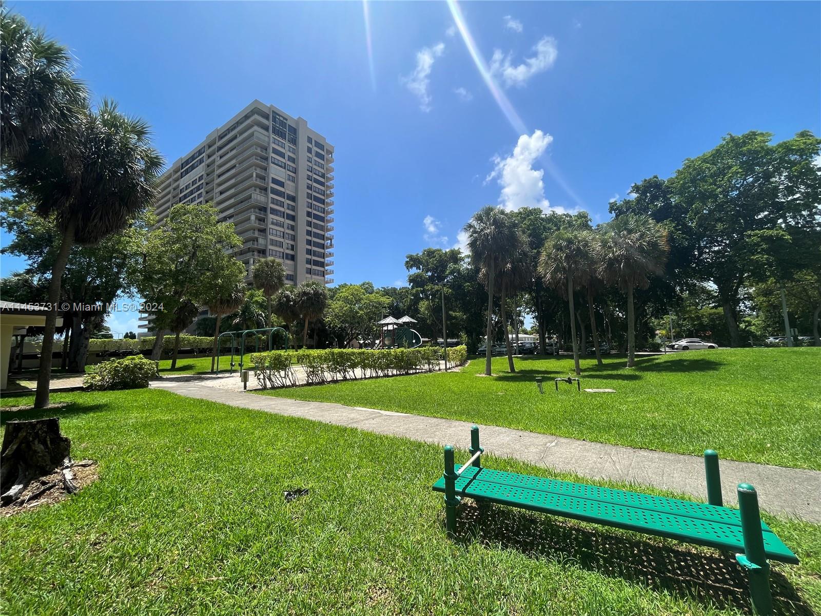 Outdoor exercise area, on a very nice garden with trees and grass.