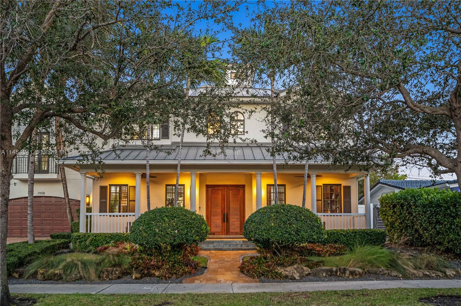 Grand entrance with tasteful landscaping