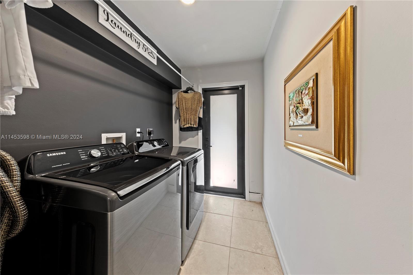 MUDD ROOM/ LAUNDRY WITH DOOR TO THE REAR OF THE PROPERTY.