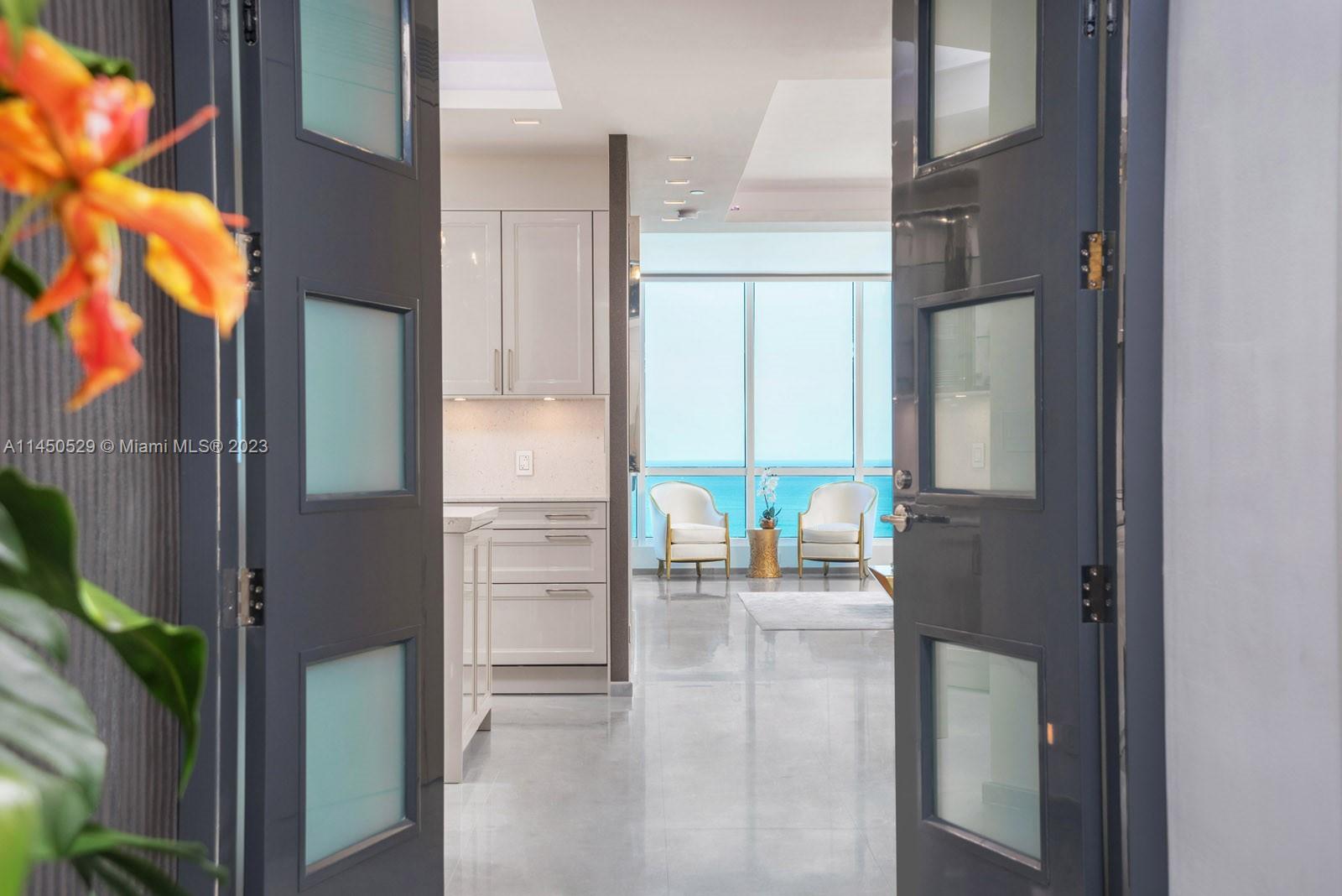Designer decorated and custom tailored w/the most luxurious finishes. The moment you enter this spectacular and desirable 06-line residence from your private elevator foyer w/double door entry you will be amazed by the breathtaking Ocean View along the entire Beach. Completely upgraded with only the finest and best materials. Very scarce Italian light grey marble floors w/special effects, Siematic German kitchen w/Miele appliances, Porsche Design lighting, Piano lacquered doors, cinema rated wall insulation, Cavalli Wall paper, Neff closets, Dornbracht fixtures, no expenses have been spared in this completely upgraded Diamond in the sky. List w/upgrades available! Hardly lived in, like new! Converted!