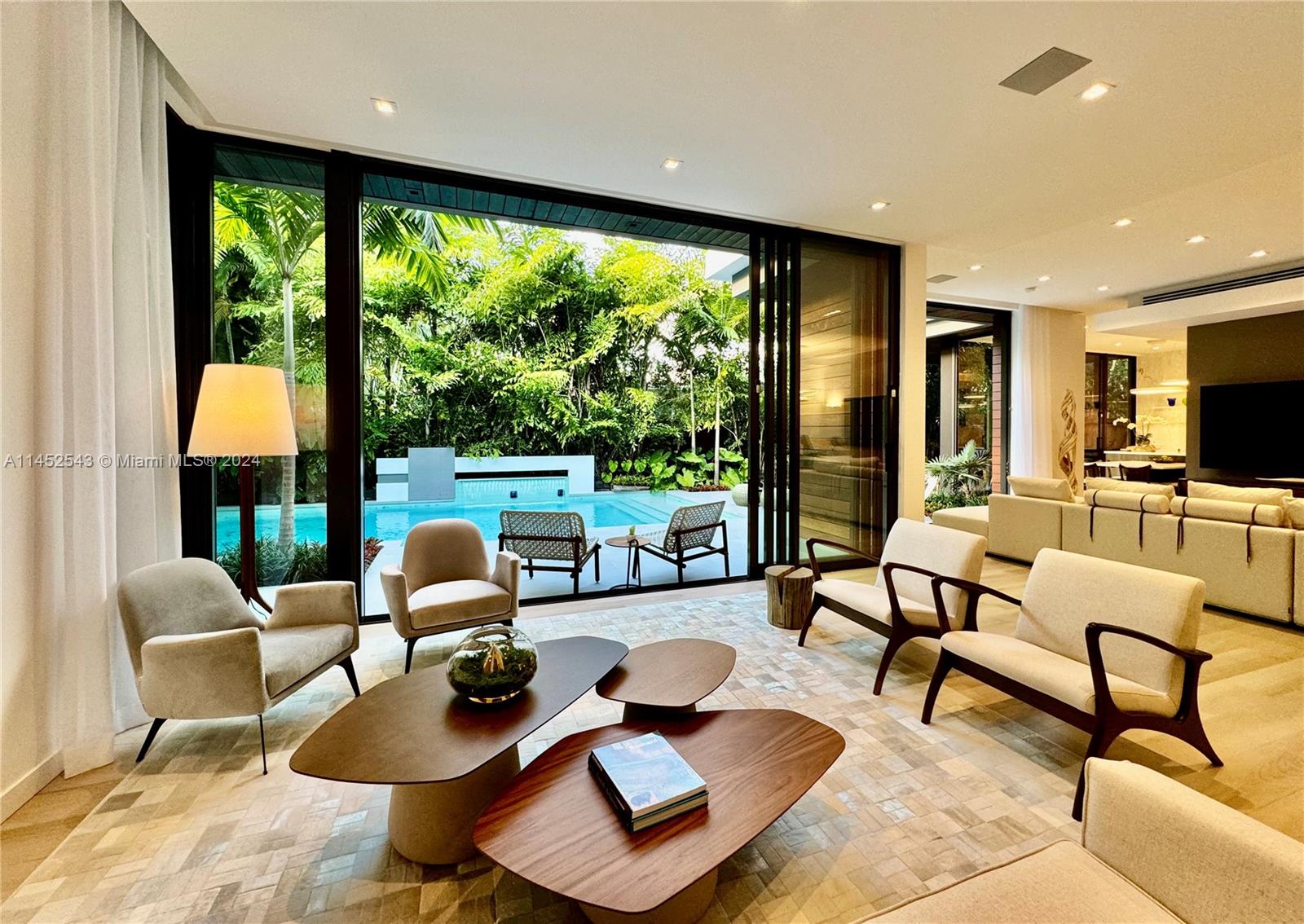 Large living/family room blending the outside with the inside seamlessly.