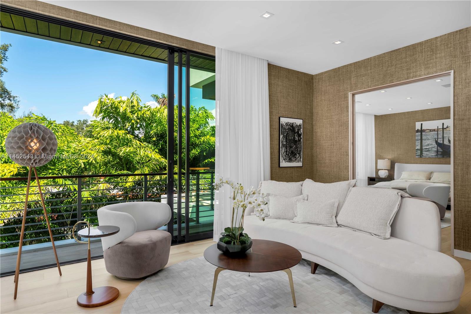 spectacular master suite with it's own sitting area or office off the patio.