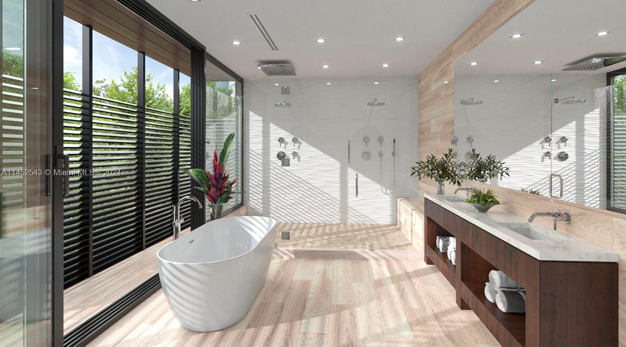 Spectacular master bathroom with dual shower and free standing tub. This is only one of the bathrooms in the master suite.