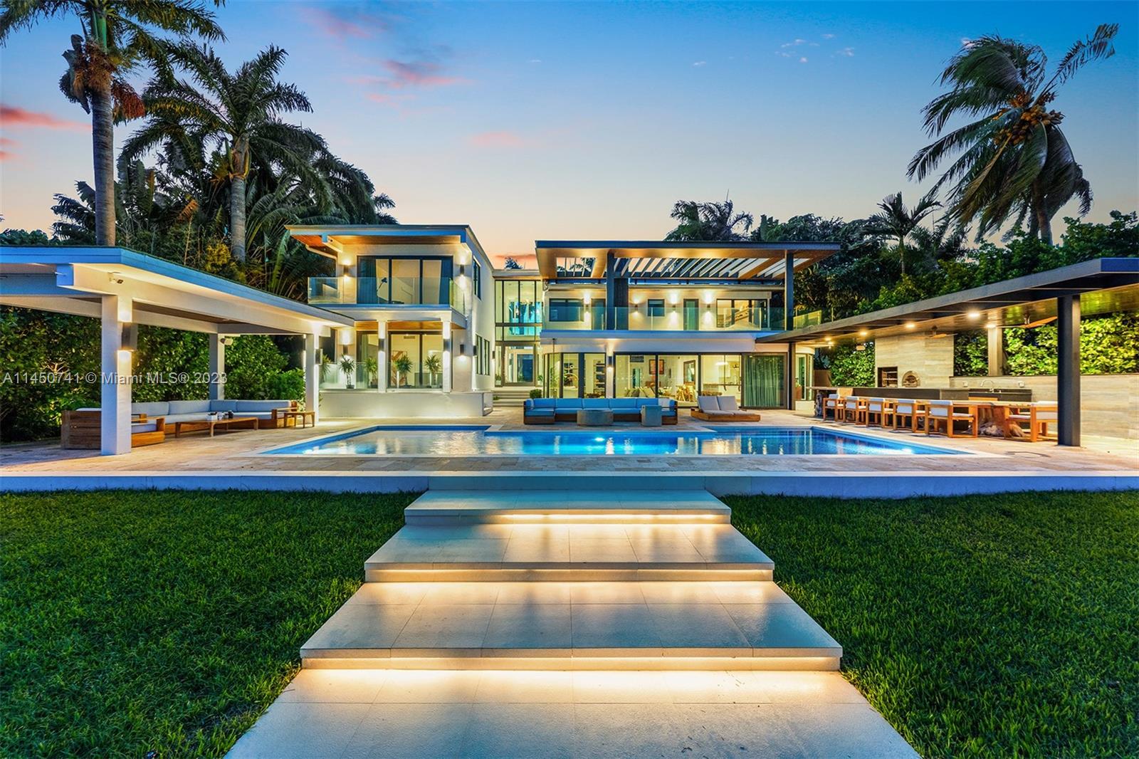 This Magnificent waterfront property on E Rivo Alto Dr. on the Venetian Islands, Miami Beach, offers 90 feet of pristine water frontage, providing breathtaking views & direct access to the beautiful waterways of Miami. The home is filled with natural light making it an amazing space for the Art Collector. Enjoy true indoor/outdoor living with an open floor plan that seamlessly connects your living spaces to the stunning outdoors & unobstructed views of Biscayne Bay. Host unforgettable gatherings with a new summer kitchen with Brazilian-style BBQ & Pizza oven, and Gas fireplaces both poolside & Dockside, creating a magical atmosphere for nighttime entertaining.  The property sits on a rare Lot & a half. Car lovers can showcase their collection through the glass of the custom 4- Car Garage.