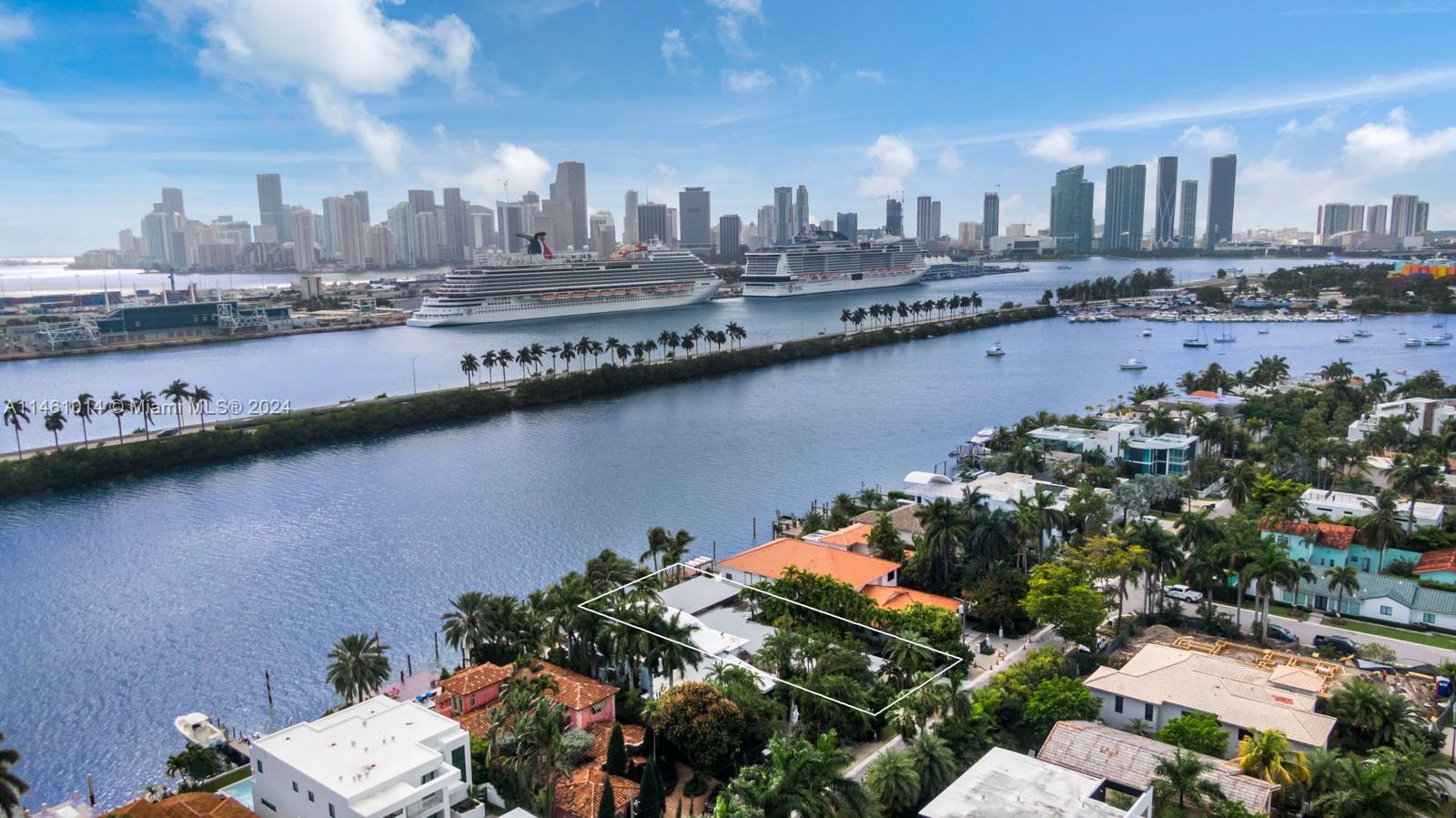 Welcome to this waterfront mid-century modern gem in the prestigious police-guarded neighborhood of Palm Island in Miami Beach! Situated on an 8,400 SF lot with 60FT of water frontage, this 4 bedroom, 2.5 bathroom home offers panoramic views of the Downtown Miami skyline and breathtaking sunsets. The oversized primary suite features dual walk-in closets and spa-like bathroom. Additional bedrooms are expansive & boast water views. Enjoy quick and easy access to the open ocean, impact windows throughout, and spacious covered parking.