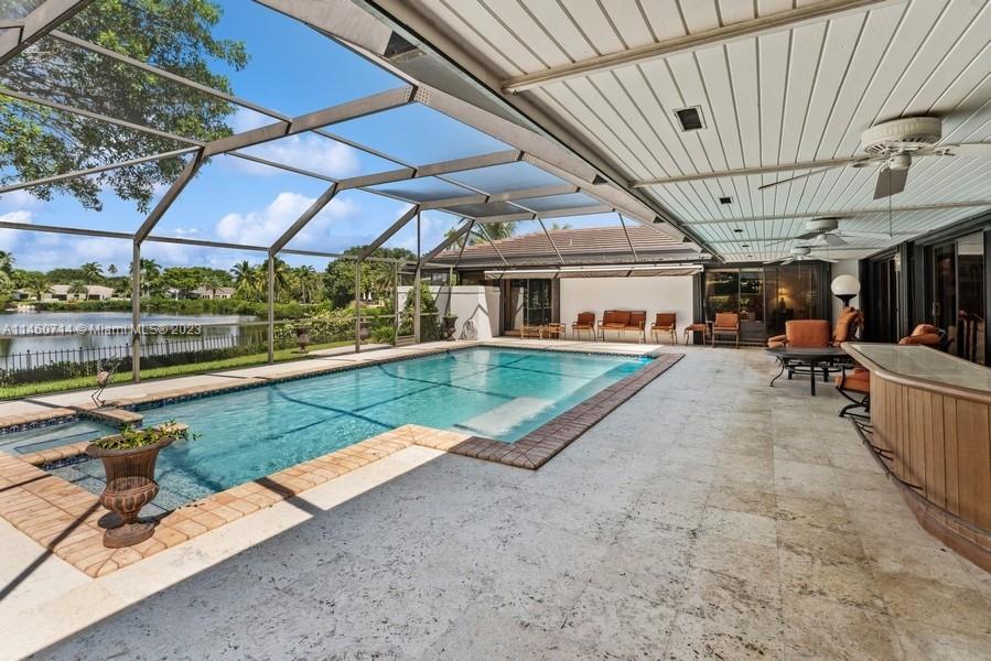 Notice the very wide overhang of the 6 year old roof that provides cover from the Sun & Rain! Also there is a very nice wet-bar with a refrigerator. And your views of the lake are beautiful!