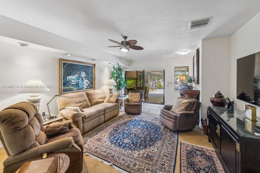 The Family room has the Kitchen in front of this space and the sliding glass doors lead out to the 