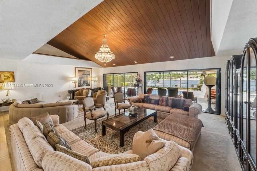 The Livingroom has walls of glass that open on to the Pool-Patio and has full views of the Lake!