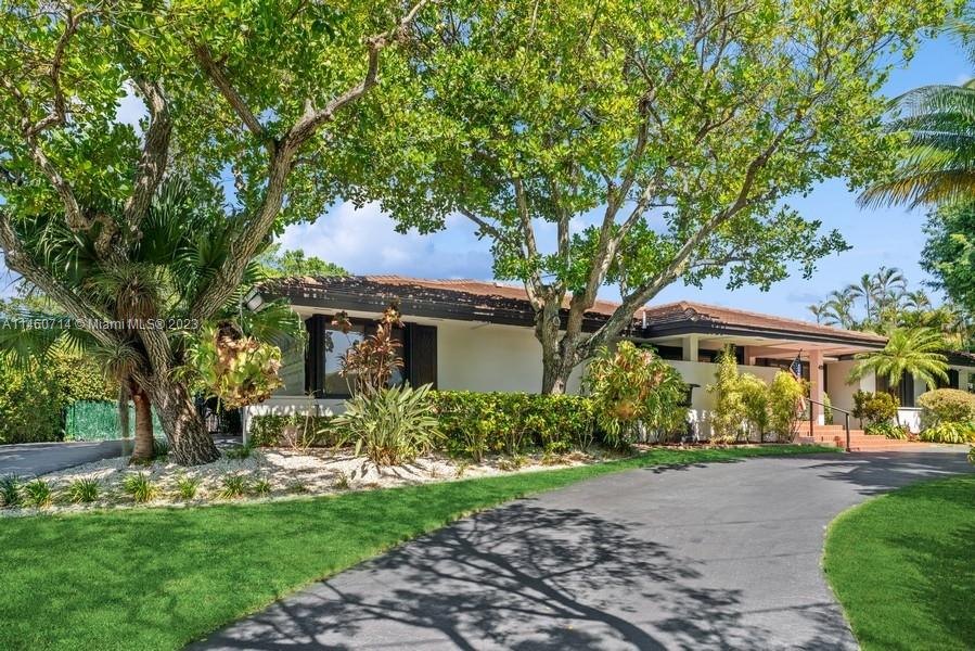 This is your view as you approach the home from the West driveway rising up several feet to meet the height of the home that has an BFE of 11' feet apx.