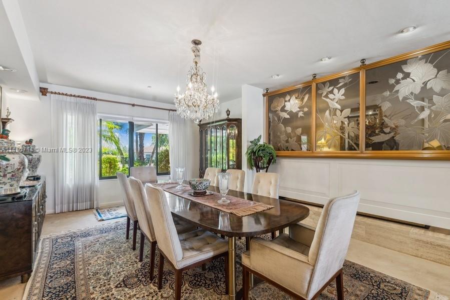 The dining room is a formal dining room  and is just steps away from the kitchen