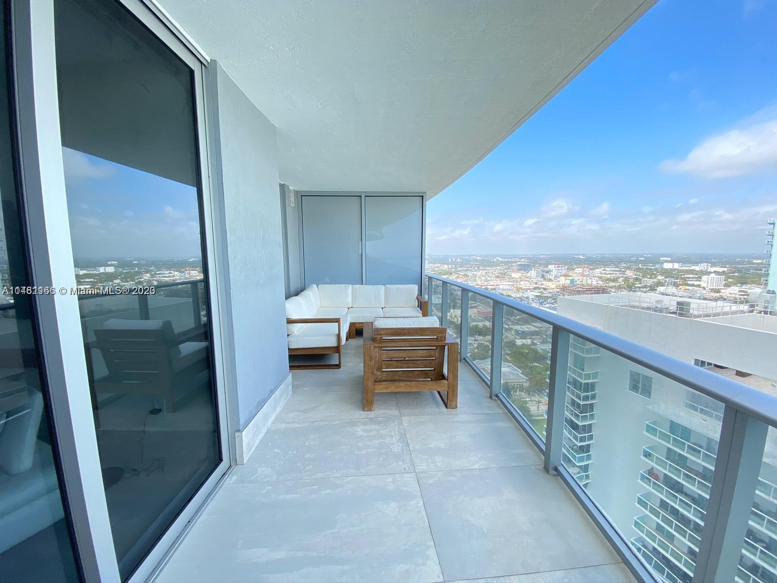 Stunning 2 Bedrooms + Den / 3 Bath Unit boasting unique upgrades and upscale finishes. The den offers flexibility to serve as a third bedroom. Enjoy a spacious balcony with captivating partial bay views, along with the convenience of a private elevator and foyer. This exclusive luxury condo is nestled in the rapidly growing Edgewater area, just a short five-minute drive from both Downtown Miami and the vibrant Miami Design and Art District. Experience resort-style amenities including 2 curved pools with sunrise/sunset views, a hot tub, theater, spa, ultimate gym, yoga, BBQ area, kids playroom, business center, social room, billiard/game room, and library. Minimum Lease Period: 6 months. Parking Space: 449.