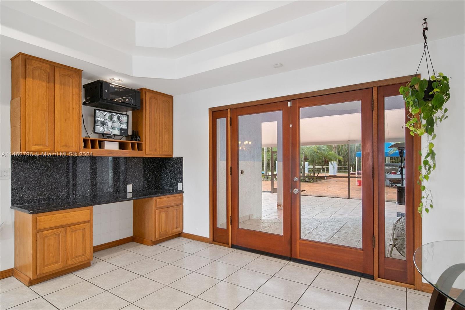 Other - Foyer with french doors leading out to breathtaking backyard oasis