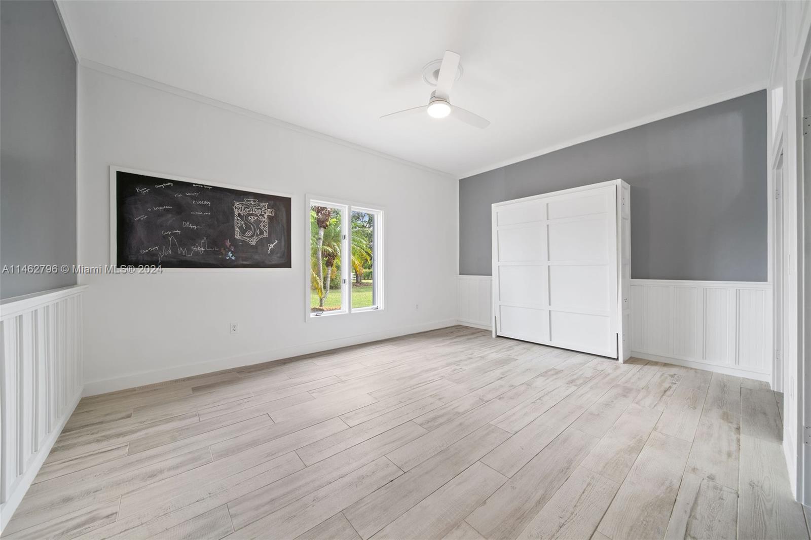 2nd bedroom with murphy bed and 2 large closets