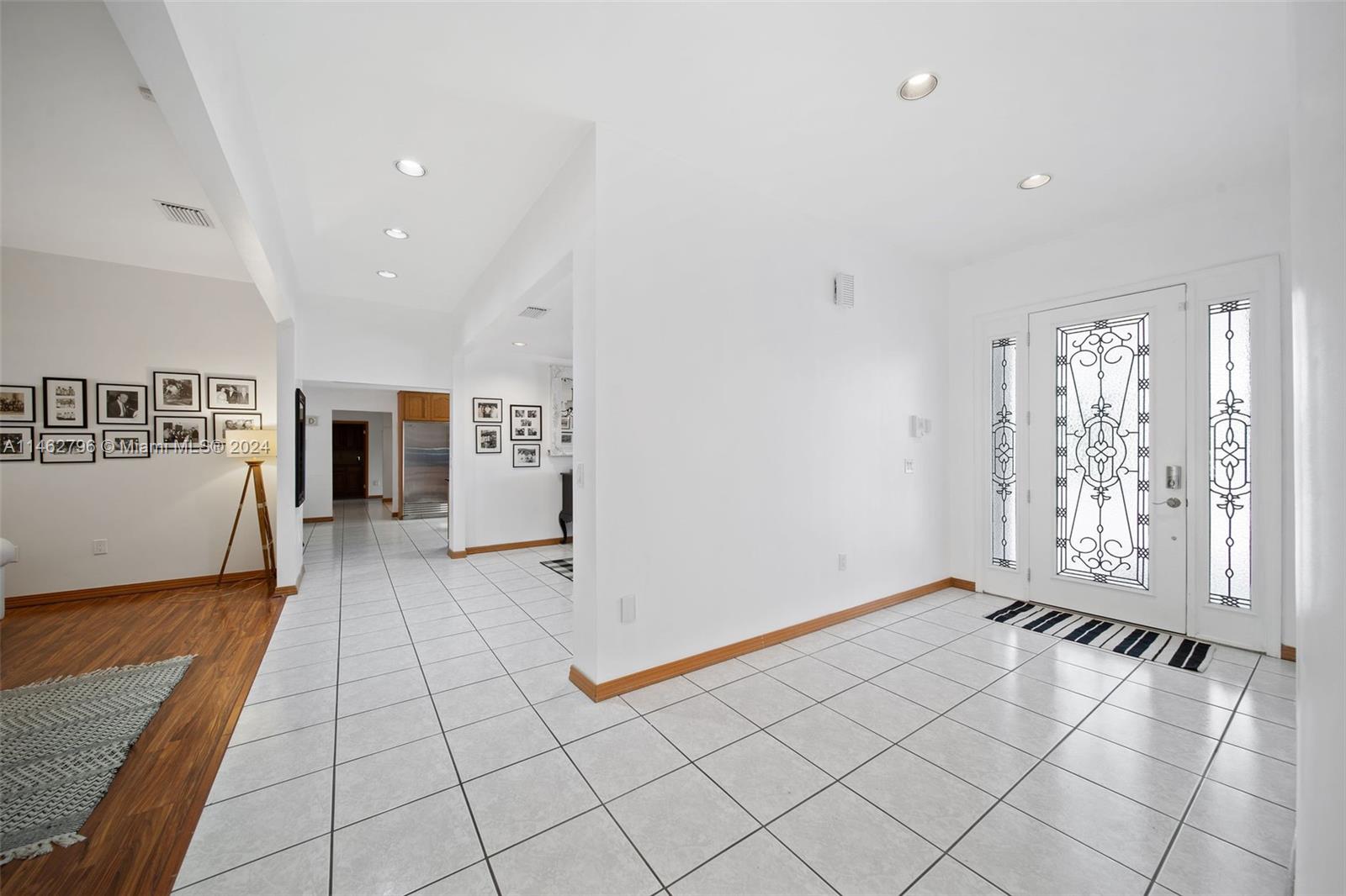 Entry - Grand entry with gorgeous ornate windows & door