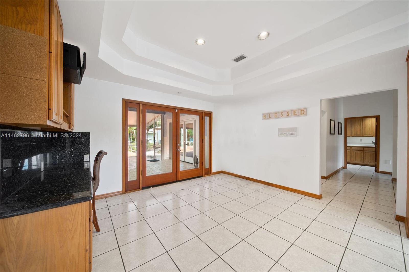 Other - Foyer with french doors leading out to breathtaking backyard oasis