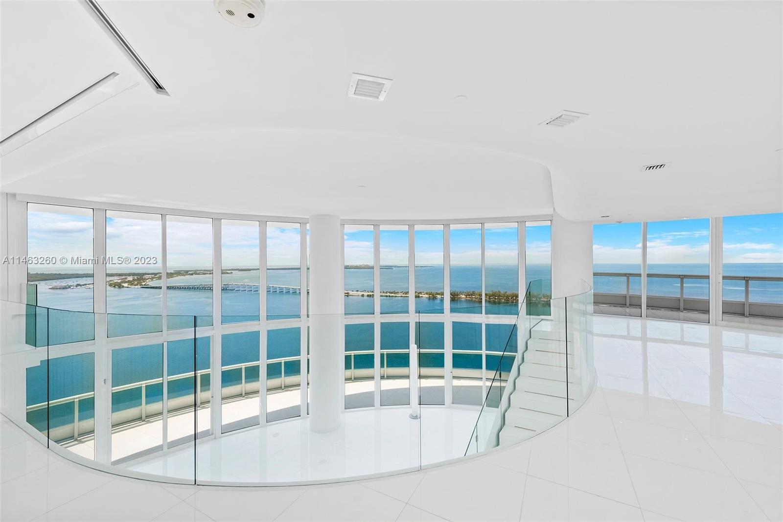 Breathtaking unobstructed views of the Bay and Ocean greet you as you step into this dramatic 2 story Townhouse on the 39th & 40th floors. 5,730 sq. ft. interiors were totally redesigned by a renowned architect and feature contemporary sleek finishes such as white glass 36"x36" flooring throughout, customized bathrooms, walk-in closets, designer doors, soffits and fixtures, motorized shades. An open kitchen with sliding frosted glass doors that open up to the spacious living room with 20 ft ceilings and a sweeping staircase. Architectural details and refined craftsmanship convey a sense of elegance and glamour coupled with unsurpassed relaxation. Santa Maria offers 5 star amenities, a fitness center, restaurant, heated pool, lighted tennis court, marina access and 24 hour security.