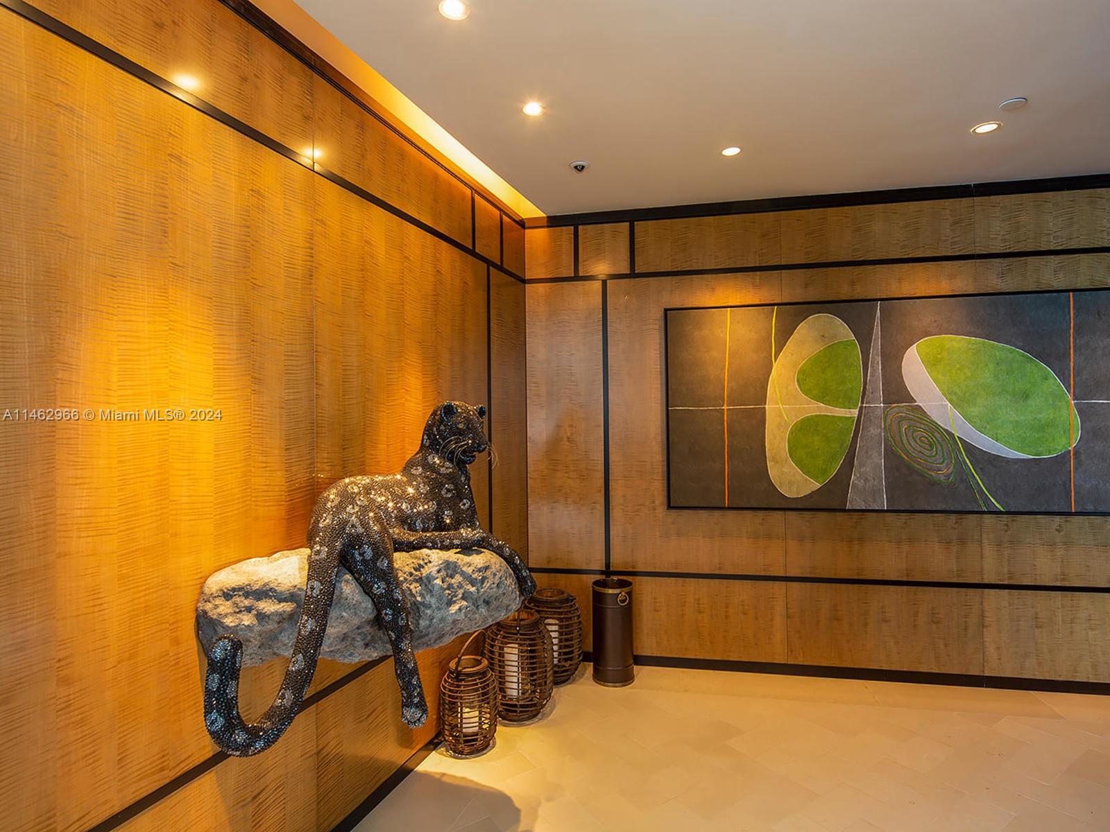 Grand Foyer entry with framed imported Italian wood wall panels