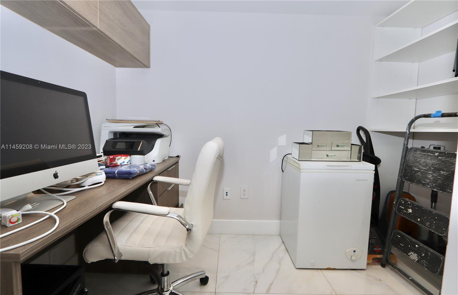 Walk in closet used as office
