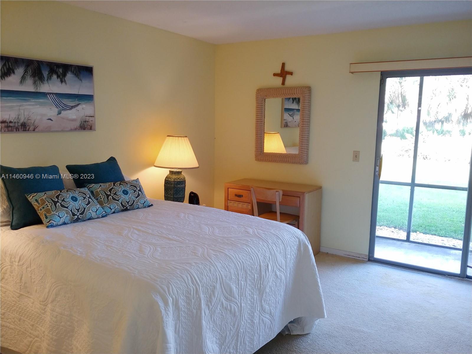 Old Photo .Bright Master Bedroom with private bathroom and screen porch