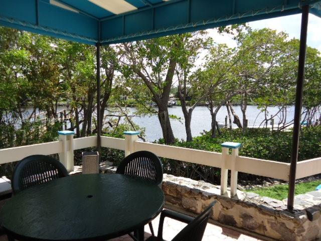 Outside or screened in dining BBQ area along the river.