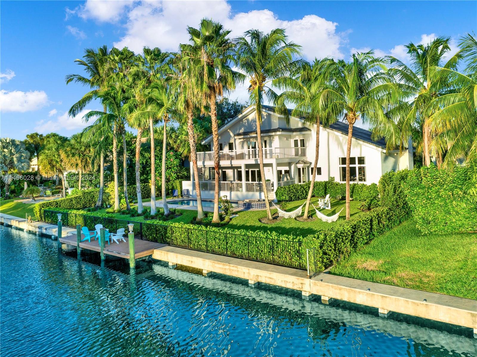 Introducing your waterfront residence, offering resort-style living in Gables by the Sea, an exclusive and serene gated community. This stunning 2-story, masterpiece underwent  renovations and upgrades with high-end finishes! The perfect blend of elegance and tranquility, with high ceilings & Porcelanosa floors harmonizing w/ breathtaking water views throughout. Awaken to the waterfront and lush tropical garden views from the master suite's balcony and get ready for the day ahead in a spacious new walk-in closet that pampers you daily. Sink into the Jacuzzi and relax as it cascades into the saline-chlorine pool. Indulge in culinary delights in the gourmet kitchen, featuring a massive natural quartzite island and Thermador & Wolf appliances. Sunset awaits in your private paradise!