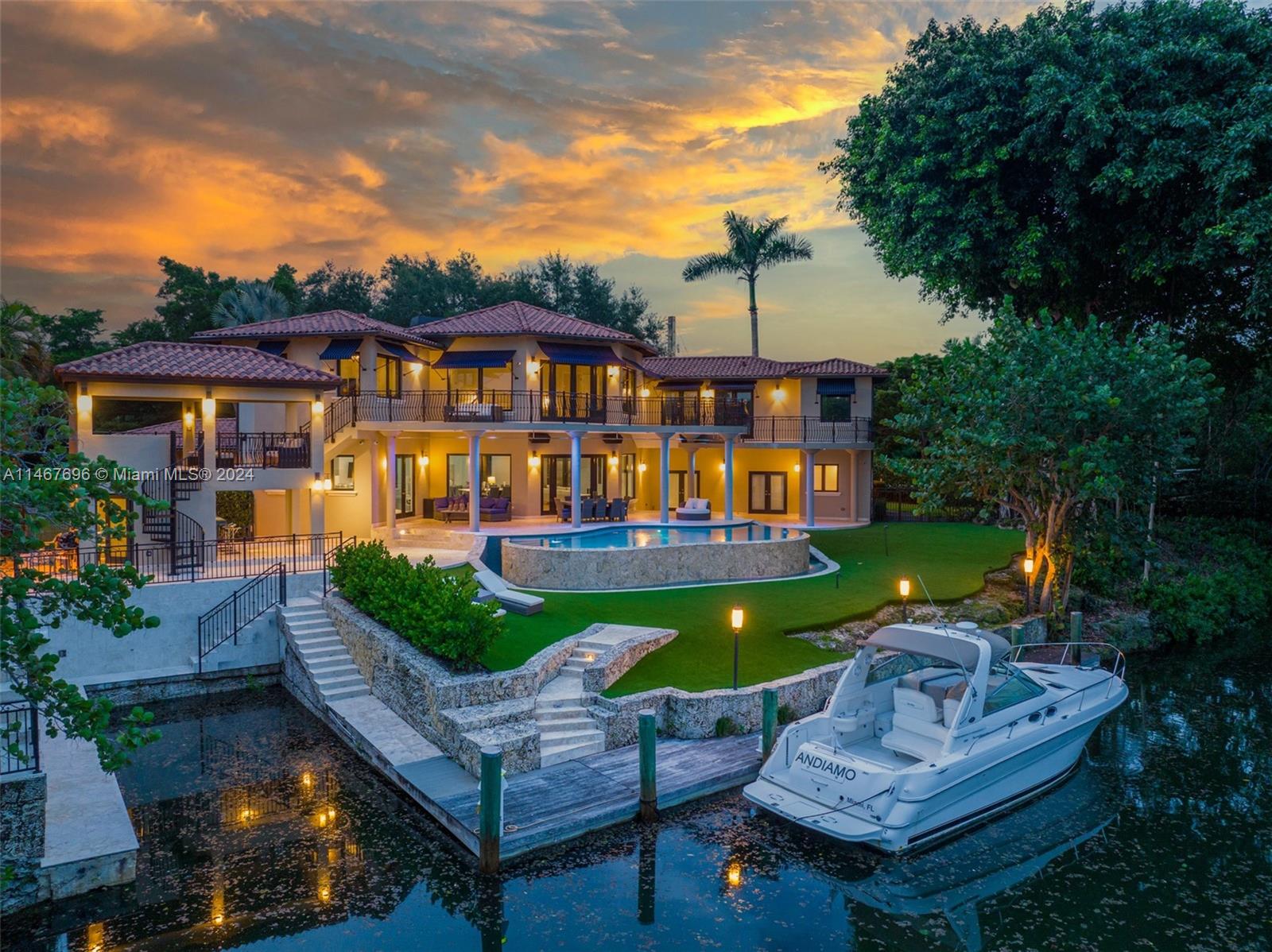 An idyllic waterfront estate, situated on a peaceful double corner lot in the heart of South Coral Gables, set against a picturesque bridge vista, stunning Banyan and mature Oak trees. A true boater's paradise with 197' on the Mahi Waterway, 60' Dock, rare grandfathered 40' boat slip and two high bridges to ocean access. The entire upper level is dedicated to two impressive Master Suites and a spacious loft. Only the finest finishes, with natural stone, mosaic tiles and Brazilian Walnut. Breathtaking large living areas, Chef’s kitchen featuring Wolf, Sub-Zero, True, Miele, Hoshizaki and Eagle Group Commercial sink. Dual gas fireplaces, Fire Magic summer kitchen, bar and lounge. Crestron Lighting Control System, Commercial Grade Audio, Hikvision Camera System and LiftMaster gate operators.