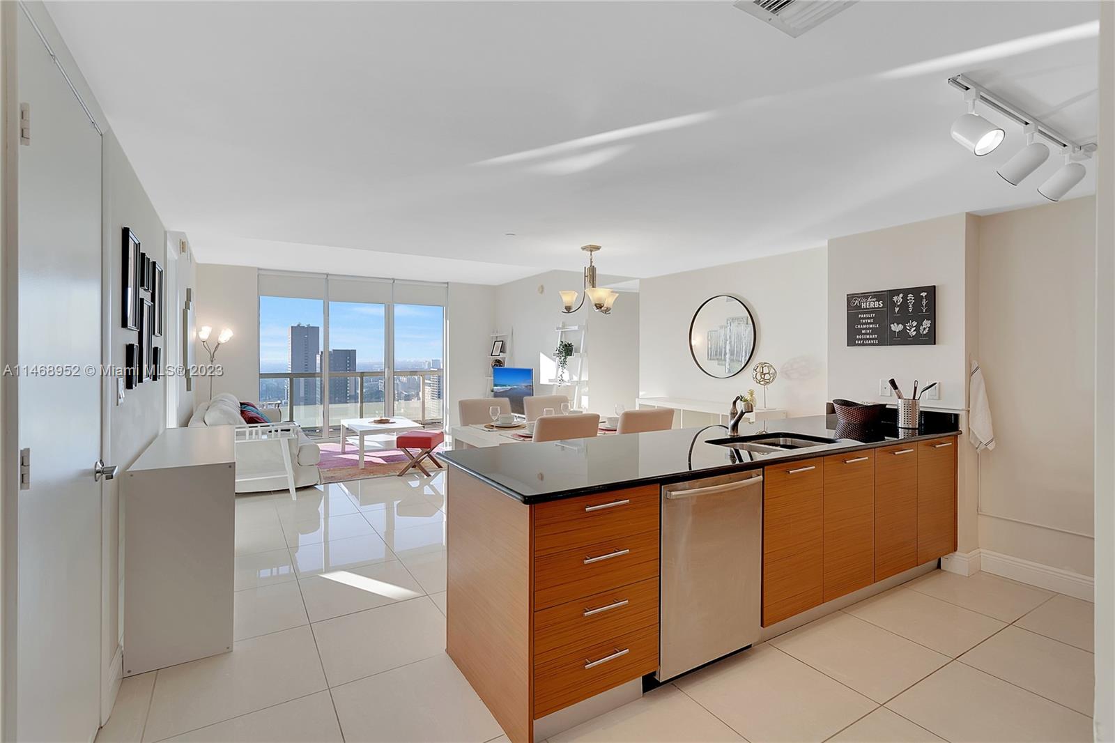 Step into luxury on the 38th floor of 50 Biscayne. This 2 bed, 2-bath condo offers breathtaking panoramic views from every window. The open living space is drenched in natural light ,, and the modern kitchen is a chef's dream. Both bedrooms have en-suite and primary suite is a private haven with balcony. Enjoy the fitness center, pool, and concierge service. you're in the heat of Downtown Miami, where culture, dining, and entertainment thrive. Elevate your lifestyle here. Schedule your private  showing today.