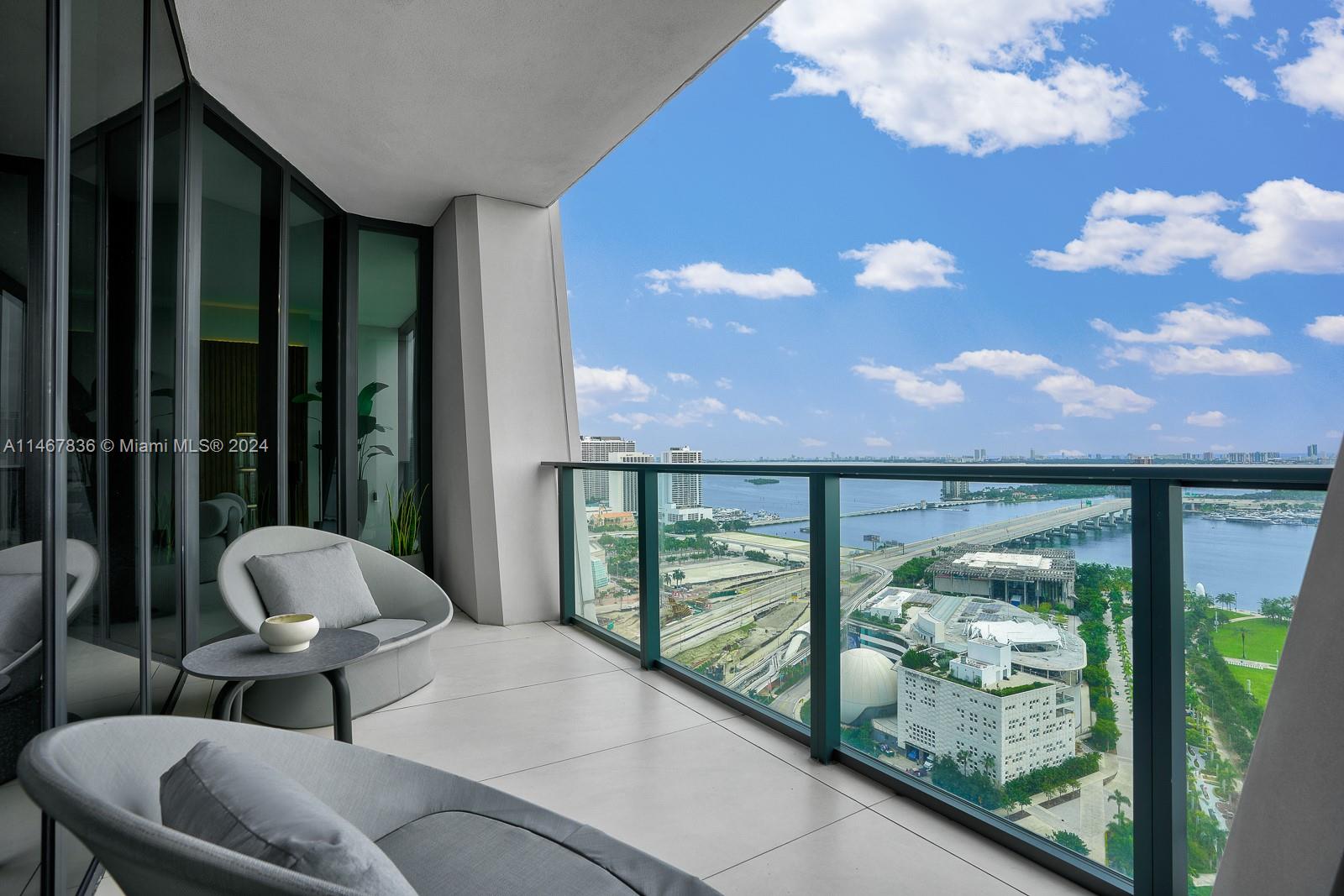 Step Inside With Me! Miami's most prized residential tower - One Thousand Museum. Housed in legendary Zaha Hadid architecture, this contemporary design residence blends warm millwork with Biscayne bay and skyline vistas. The preferred South corner floorplate offers 4 generous suites, an expansive 48 FT Eastern facing salon, and sleek Poliform kitchen with Gaggenau and Subzero appliances. Daily sunrises and sunsets from both social and guest wings are appreciated from this ultra modern, primely positioned mid-high floor abode. With just 84 sky homes in this boutique skyscraper, the privileged amenity levels include a bespoke spa, fitness center with customized personal training programs, indoor & outdoor pools, personal safety deposit boxes & a one of a kind sky lounge with helipad access.