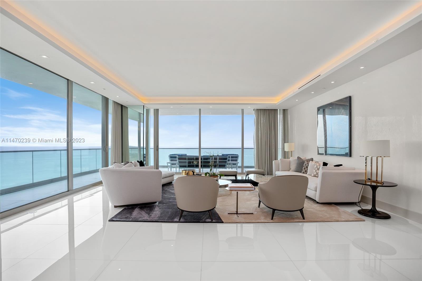 Stunning fully furnished corner 3 bed/3.5 bath unit at the prestigious Oceana residences in BalHarbour. Direct ocean and city views with a wrap around balcony Beautiful imported pure white marble floors throughout living and common areas and imported oak wood floors in the bedrooms. All custom closets wrapped with Italian leather. Included are all the custom designed Minotti and Fendi furniture, lighting fixtures, and sculptures in this meticulously maintained property. Owner only used the residence twice per year, everything is in mint condition, hardly any signs of wear and tear throughout the property. Unit comes with 3 dedicated parking spaces. All custom window shades and lighting controlled electronicaly, custom TV's built into mirror's throughout the home.