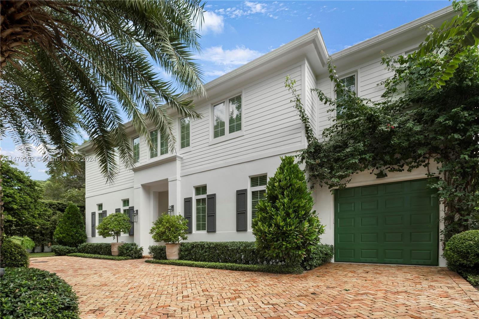 Experience unparalleled luxury in this one-of-a-kind 2018 colonial style home in Coral Gables. Situated on a gated corner lot, this 4 bed, 4.5 bath residence showcases exquisite finishes, including herringbone oak floors, custom Ornare kitchen cabinets and closets, top-of-the-line appliances including 48" Wolf gas range and Subzero refrigerator & freezer, water filtration system, full marble slabs and brass metals in the bathrooms. With a Creston system for automation, CGI Sentinel windows, and a Lynx BBQ set, this home effortlessly combines technology, security, and outdoor entertainment. Enjoy the heated/cooled pool, generator for uninterrupted comfort, and the tranquil Japanese Blueberry hedges. COMPETITIVE OWNER FINANCING UPON QUALIFICATIONS.