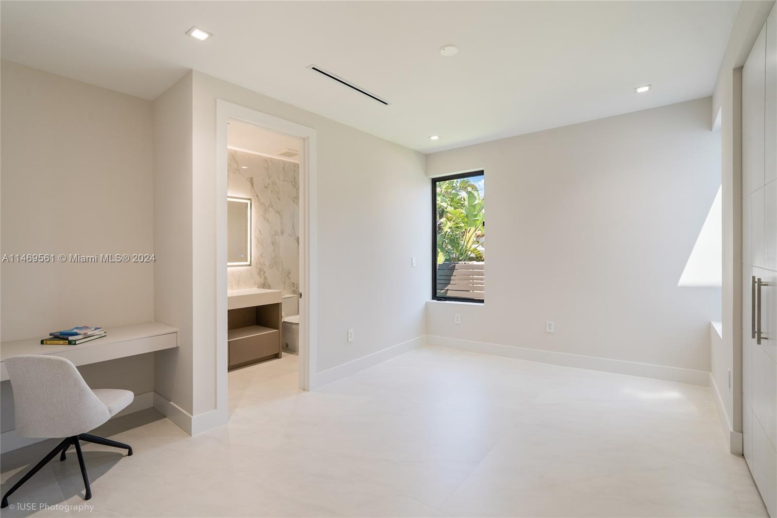 Bedroom 2 on-suite bathroom Features: custom-made vanity with quartz stone , frameless shower .