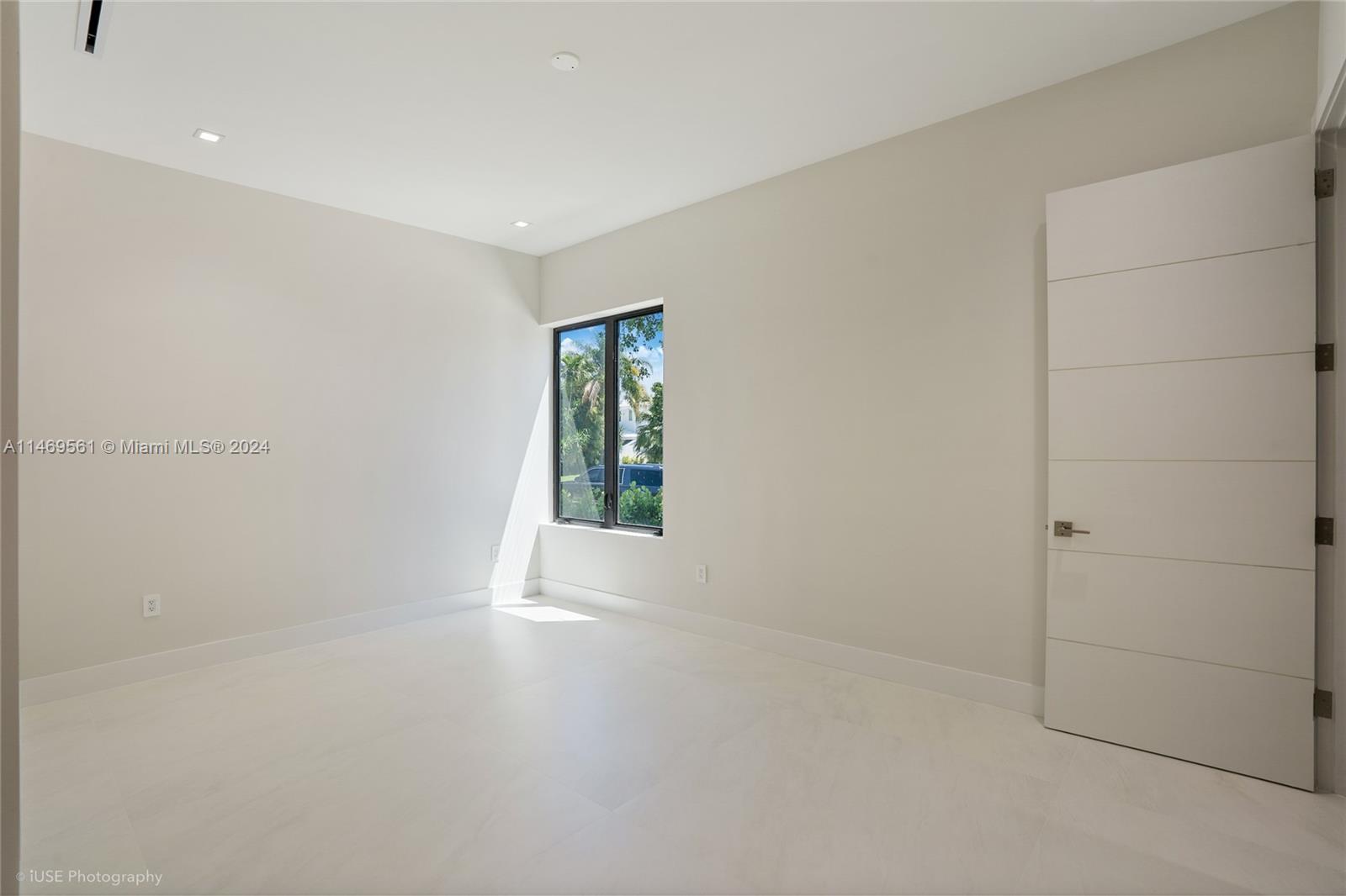 Bedroom 3 on-suite bathroom features: custom-made vanity with quartz stone, frameless shower, and mirror with anti-fog and dimmable LED lighting.