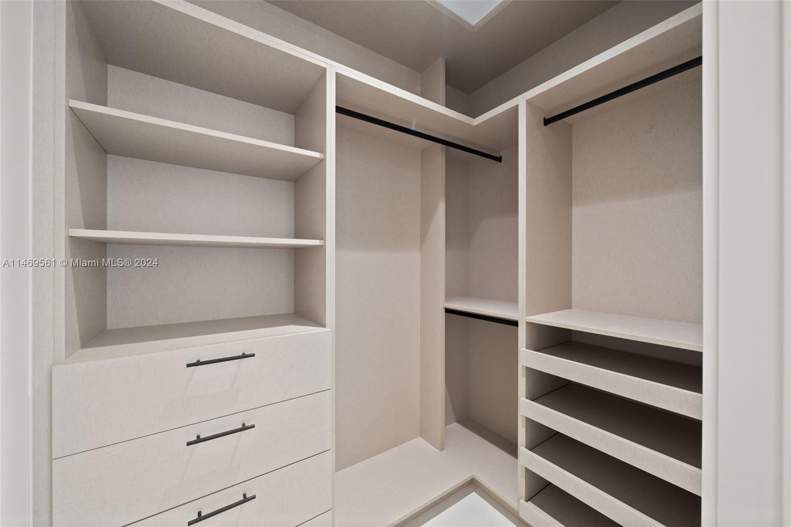 full bathroom /Powder room .....features ; Crystal pendant light ,custom-made vanity with stone sink ,frameless shower and walnut color slat wall panels .