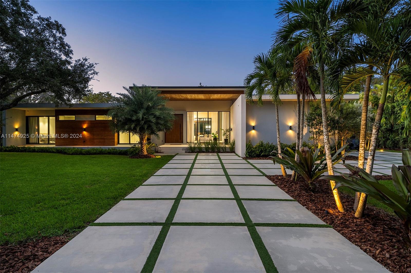 Nestled in the exclusive Pinecrest enclave, this masterpiece boasts 6 beds & 6.5 baths, on a generous 38,766 sqft lot. You'll be welcomed by the impressive 11 ft hurricane-proof Mahogany pivot door and ceilings ranging from 10 -14 ft. The home is adorned with stunning wallpaper, wood panel walls, electric blinds, & floating drywall, adding to its allure. The kitchen is a chef's paradise, featuring Italkraft cabinets, qrtz countertops, top-tier Miele, Wolf, & Liebherr appliances. Each bedroom offers a sanctuary with en-suite baths & designer Mia Cucina closets. Additionally, there is a guest house on the property. Convenience is key, with proximity to elite schools, high-end shopping, pristine beaches, & easy access to expressways, making this property the epitome of luxurious living.