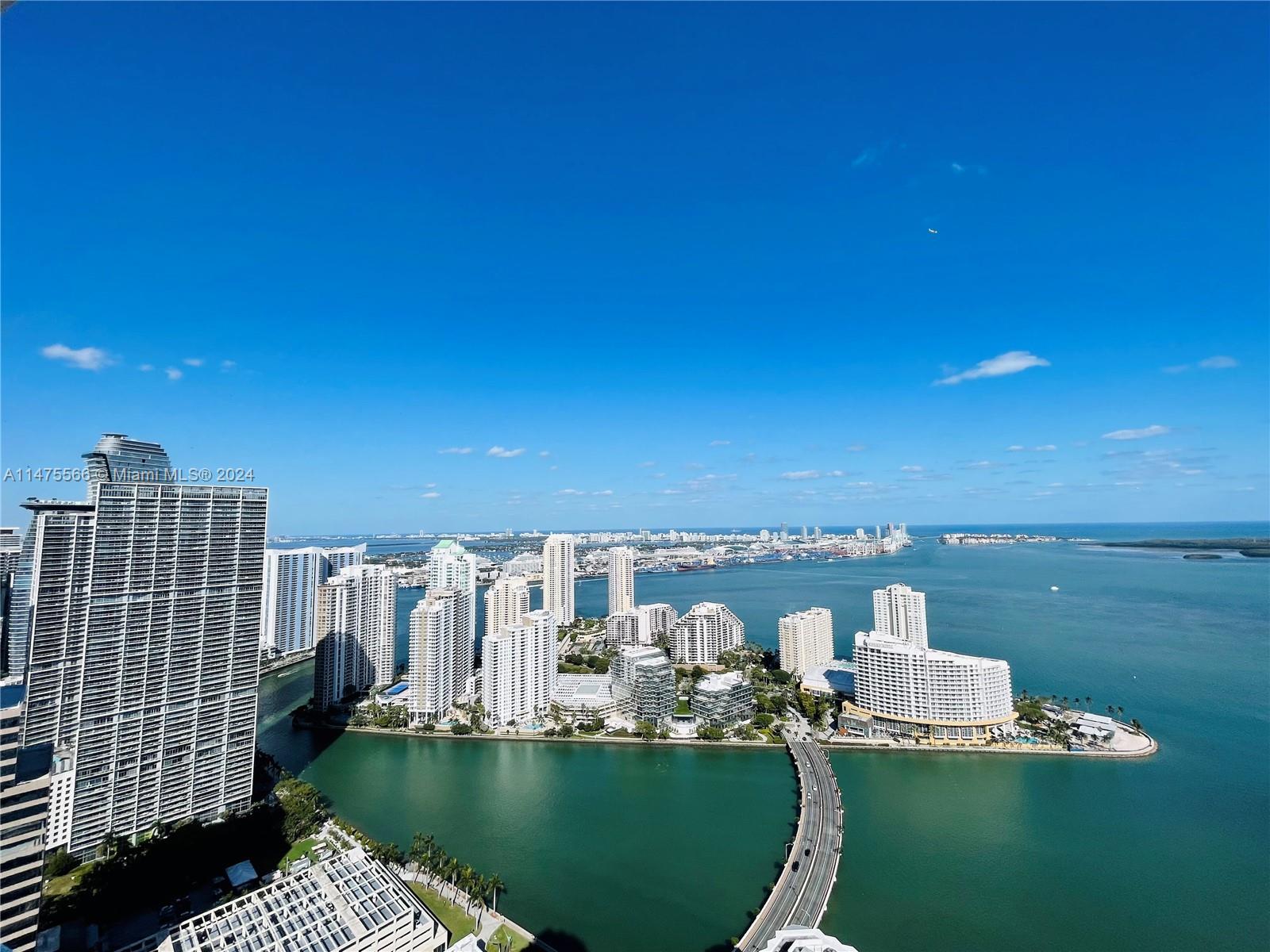 Amazing 2 /2 .5 bath unit with direct Biscayne Bay views on the 52nd floor. Vary spacious unit with 2 walk in closets. Unit has modern porcelain floors throughout. Residence features GE Monogram  & Bosch stainless steel appliances, high foot ceilings, imported italian cabinetry.  Fantastic amenities:24 hr security and concierge, 24 hour valet parking, State of the art Fitness Center in each tower, 2 Infinity-edge heated pools, Steam room,Theater room, Business center, party room, pool table, lounge and more. Walk to Mary Brickell Village and Brickell City Center mall. One assigned covered parking space. HOA includes water, basic cable & internet.