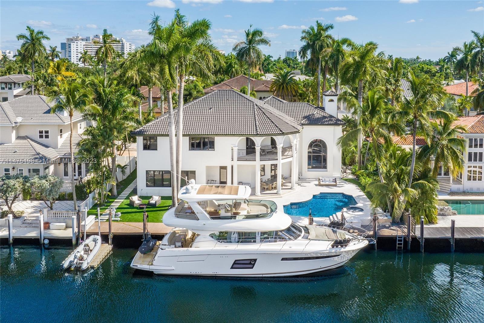 Welcome to this sophisticated and fully renovated waterfront estate, boasting 100 feet of deep water frontage that is sure to take your breath away! This tropical oasis features five bedrooms, four and a half bathrooms, and a spacious primary suite with walk-in closets. Enjoy the expansive terrace offering captivating water views, along with the convenience of two laundry rooms. With elegant staircases and a VIP guest suite alongside three additional en suite bedrooms. Experience the true vacation-style lifestyle, with a summer kitchen, spa for ultimate relaxation, and a bonfire area for unforgettable gatherings. Positioned in one of the best areas of Fort Lauderdale, this is an unparalleled opportunity to live life to the absolute fullest.