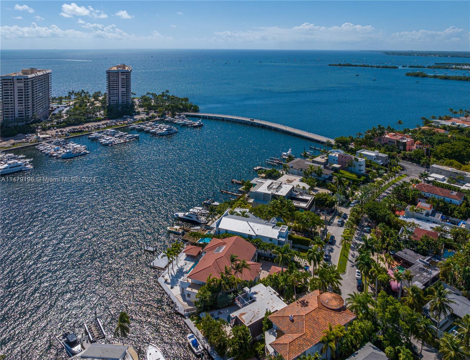 Bayfront - Coconut Grove with 139 ft of water frontage on a wide point lot w/rare substantive dockage. Price improved to $13,000,000 making this an exceptional value in one of Miami's prestigious areas. The existing home offers a canvas for updates or to embark on complete redevelopment. 8 BD, 10.5 BA, and a separate guest house. A-rated schools, tree-filled parks and bikeways, shopping, and numerous culinary restaurants. Tailor-made for water enthusiasts and boat lovers!