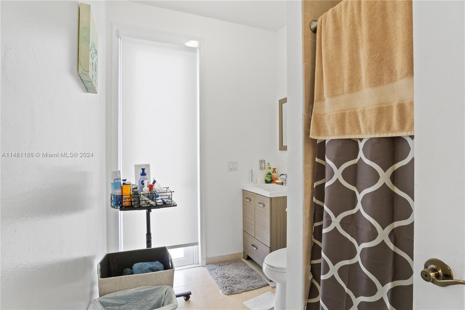 Full Bathroom for the first floor room with door that connects to the patio