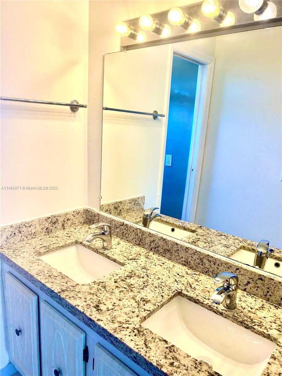 Vanity with dual sinks with granite top